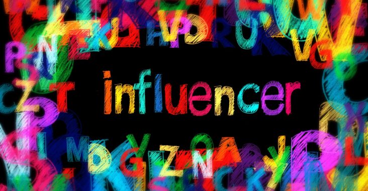 Black background with jumbled letters in bright colours aking the edges with the word influencer written in the center
